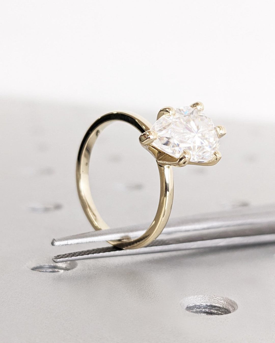 Pear solitaire diamond ring presented in signature gift packaging