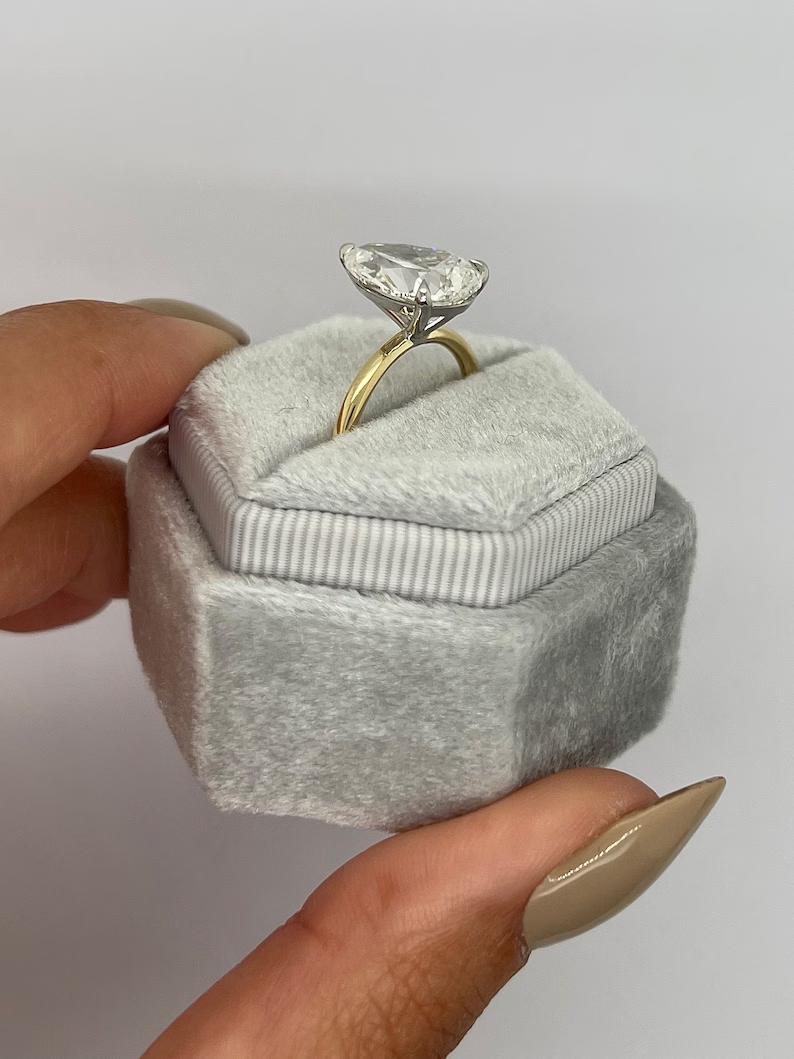 Angled view of pear cut diamond in solitaire setting