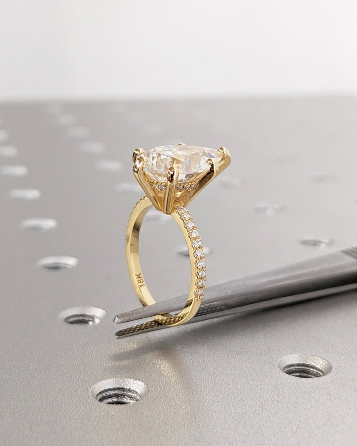 Top-down view of pear cut hidden halo engagement ring