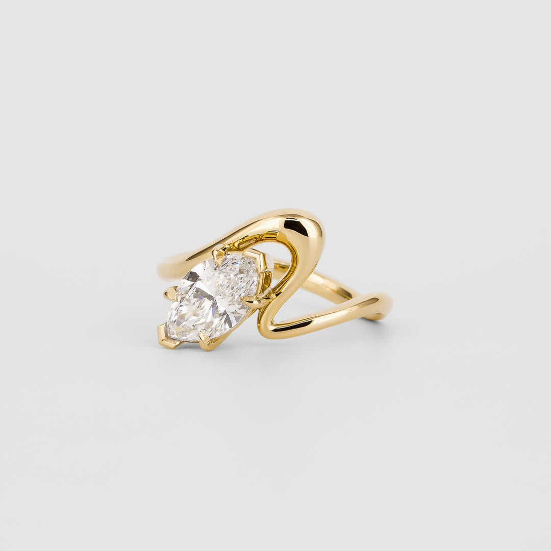 Marquise solitaire engagement ring close-up highlighting diamond sparkle