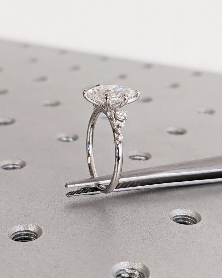 IGI certified marquise cut diamond in cluster engagement ring setting