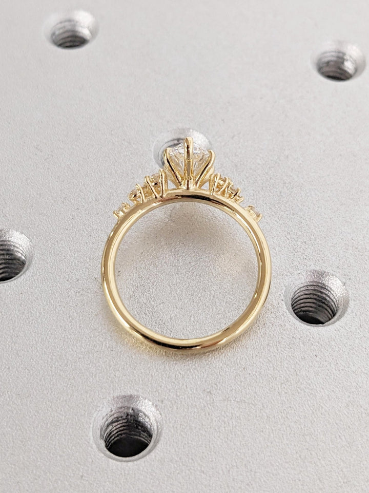 Macro shot of marquise cut diamond facets in cluster ring setting