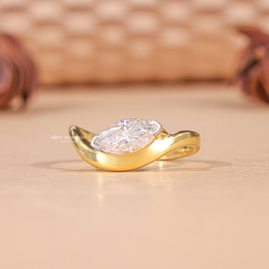 Marquise solitaire engagement ring offered in gold and platinum
