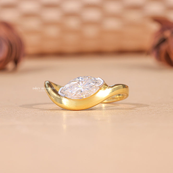 Marquise solitaire engagement ring offered in gold and platinum