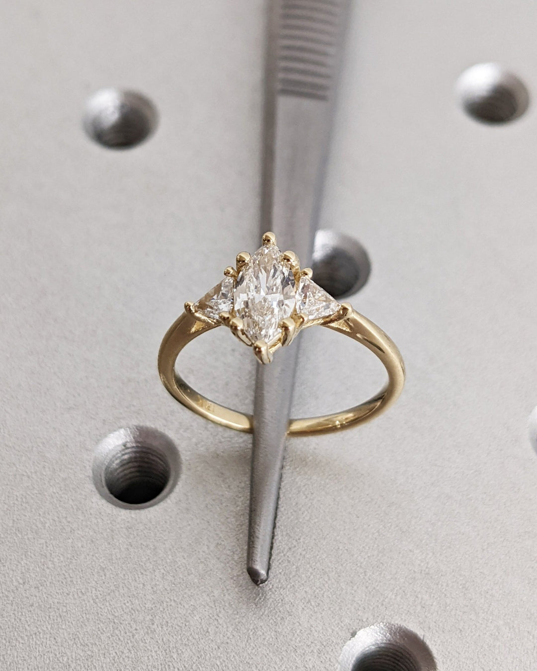 Marquise solitaire engagement ring viewed from the side