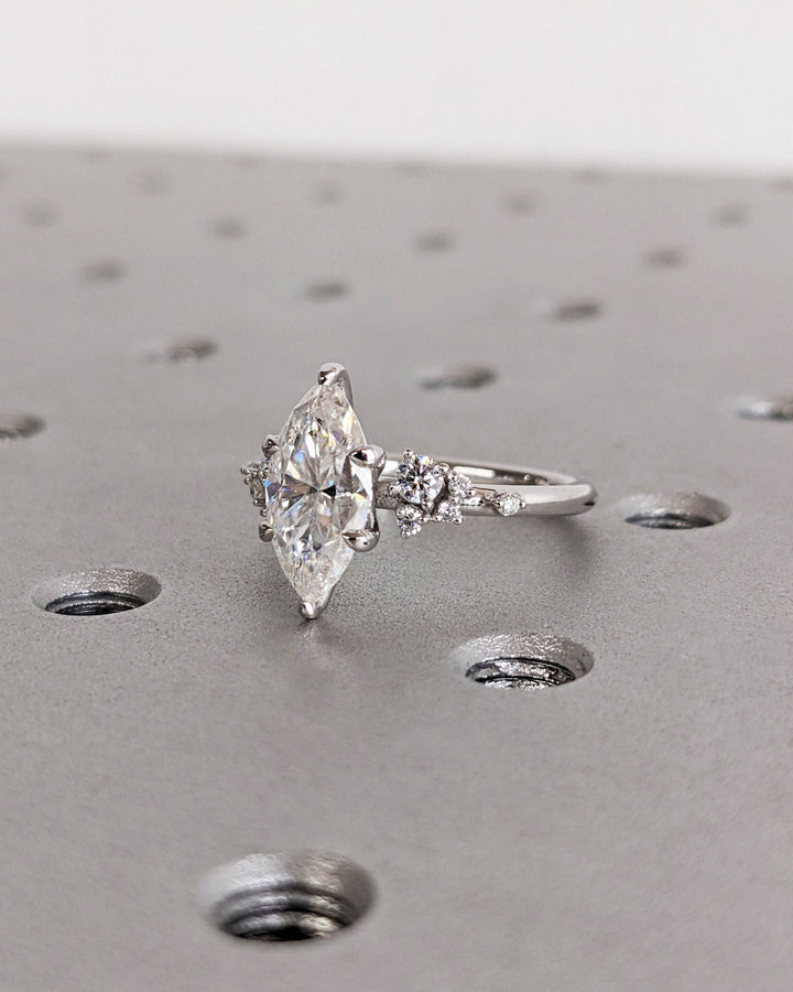 Marquise cut cluster engagement ring with IGI certified center diamond