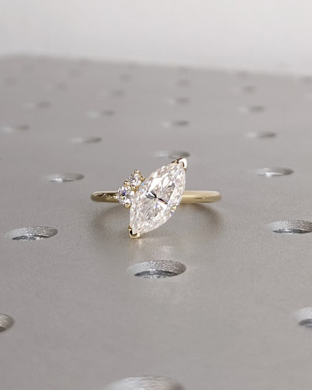 Marquise cluster diamond engagement ring available in multiple metals