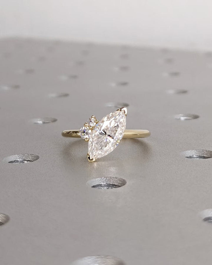 Marquise cluster diamond engagement ring available in multiple metals