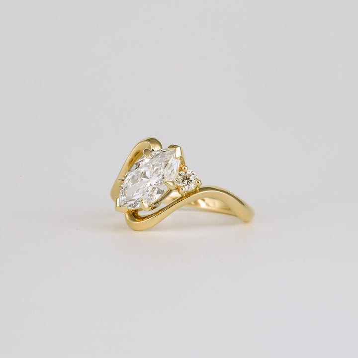 Fine craftsmanship detail on marquise solitaire engagement ring