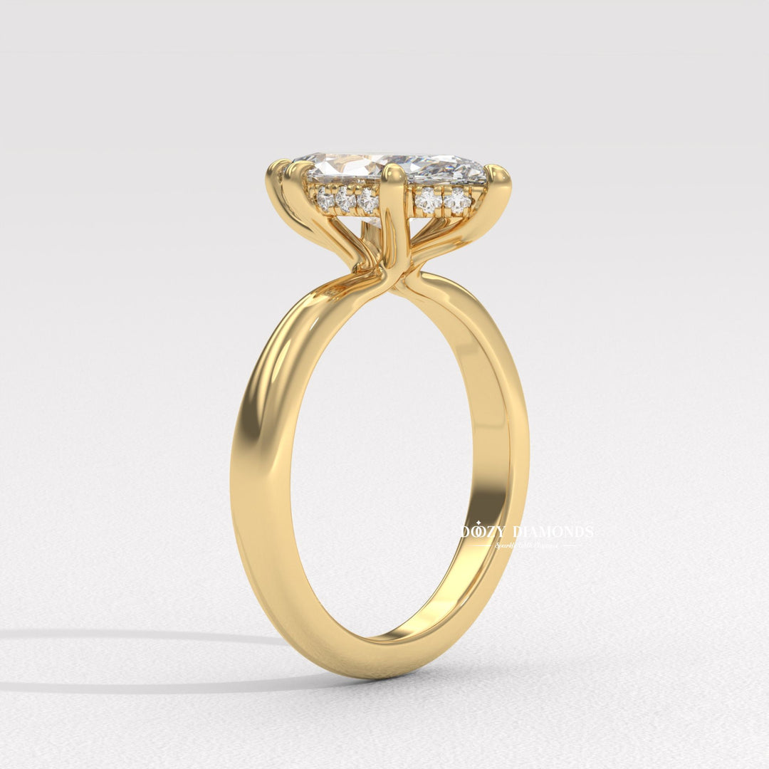 Fine craftsmanship detail on marquise hidden halo engagement ring