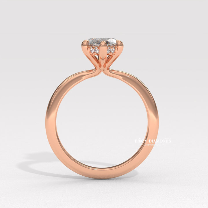 Angled view of marquise cut diamond in hidden halo setting