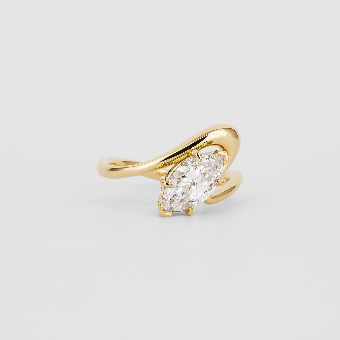 Close-up of marquise cut center diamond in solitaire engagement ring