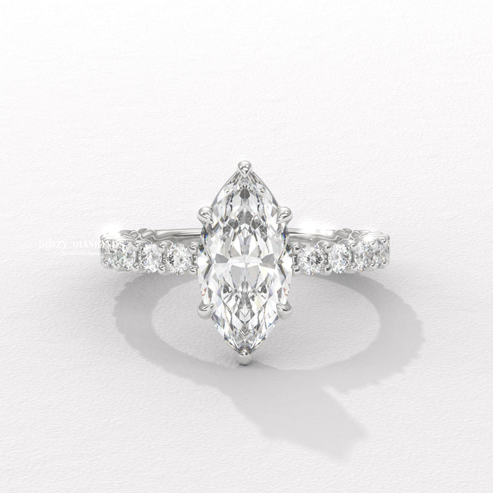 Marquise solitaire engagement ring shown on hand for true-to-life sizing
