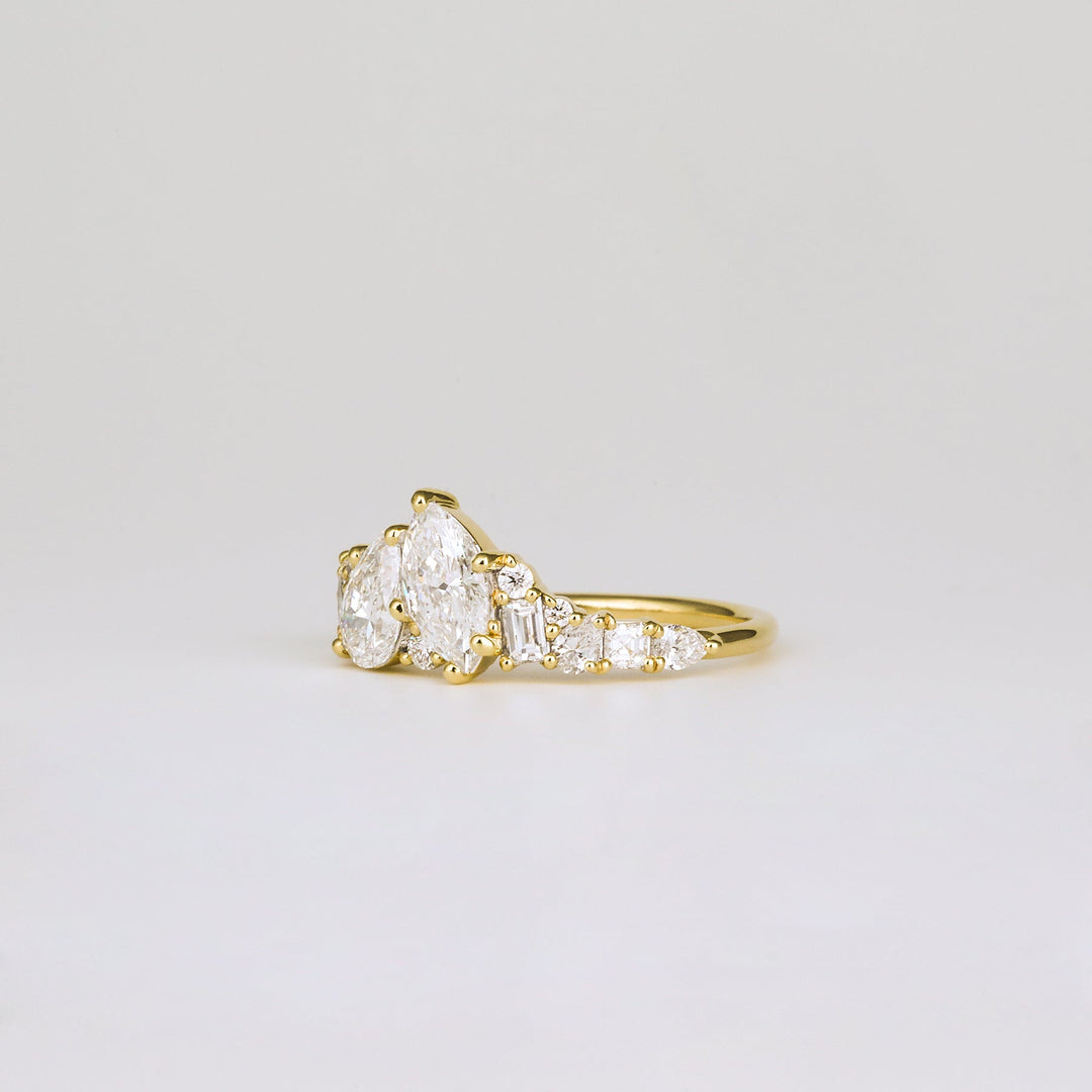 Premium pear cut cluster engagement ring crafted in solid gold