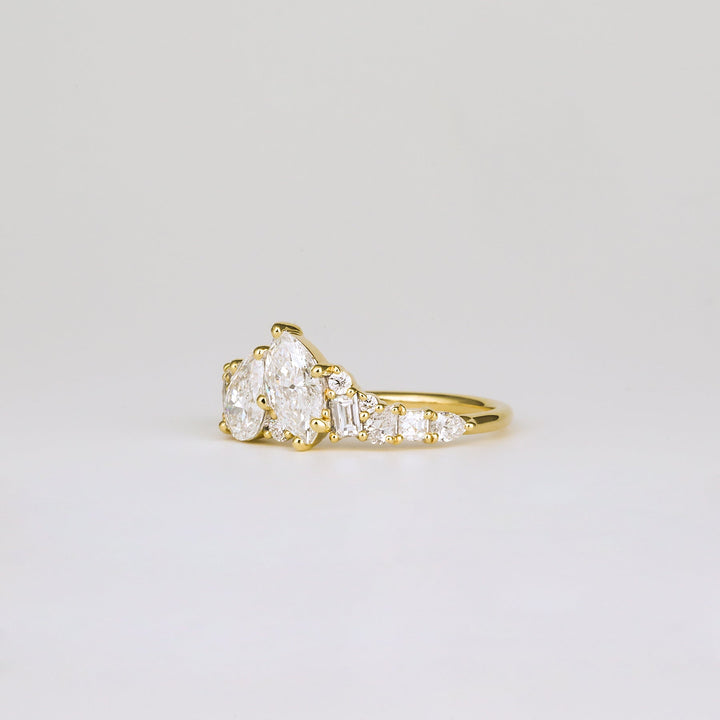 Premium pear cut cluster engagement ring crafted in solid gold
