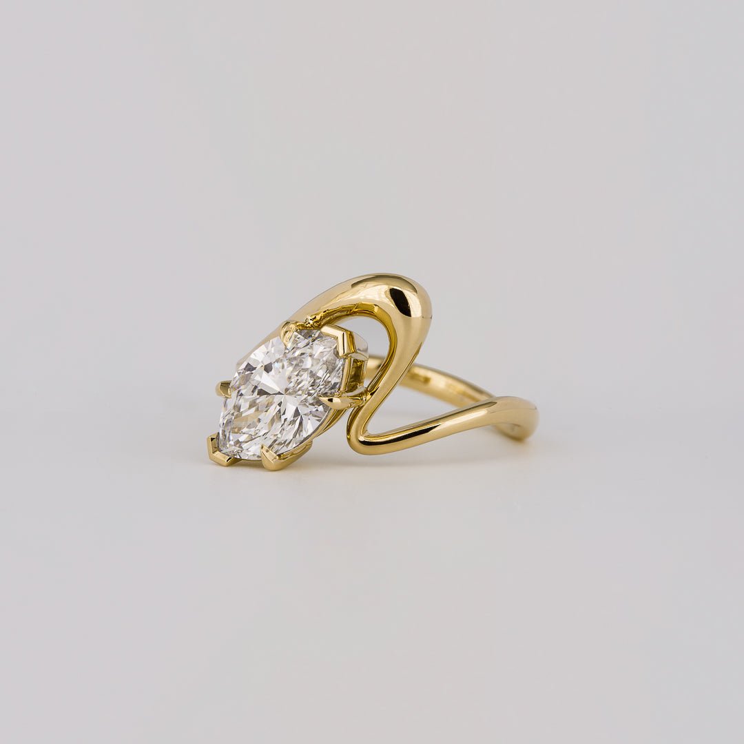 Macro shot of marquise cut diamond facets in solitaire ring setting