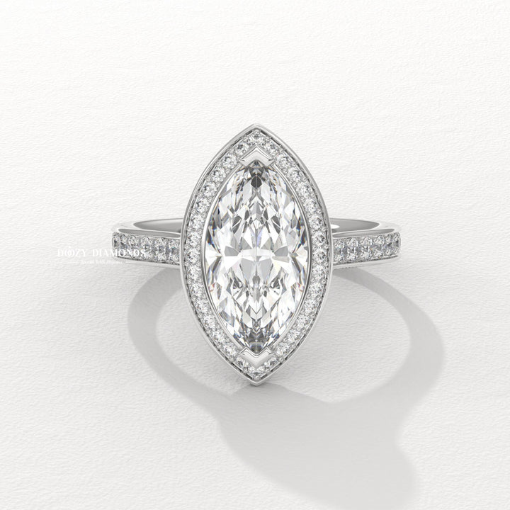 Marquise halo engagement ring finished in polished solid gold