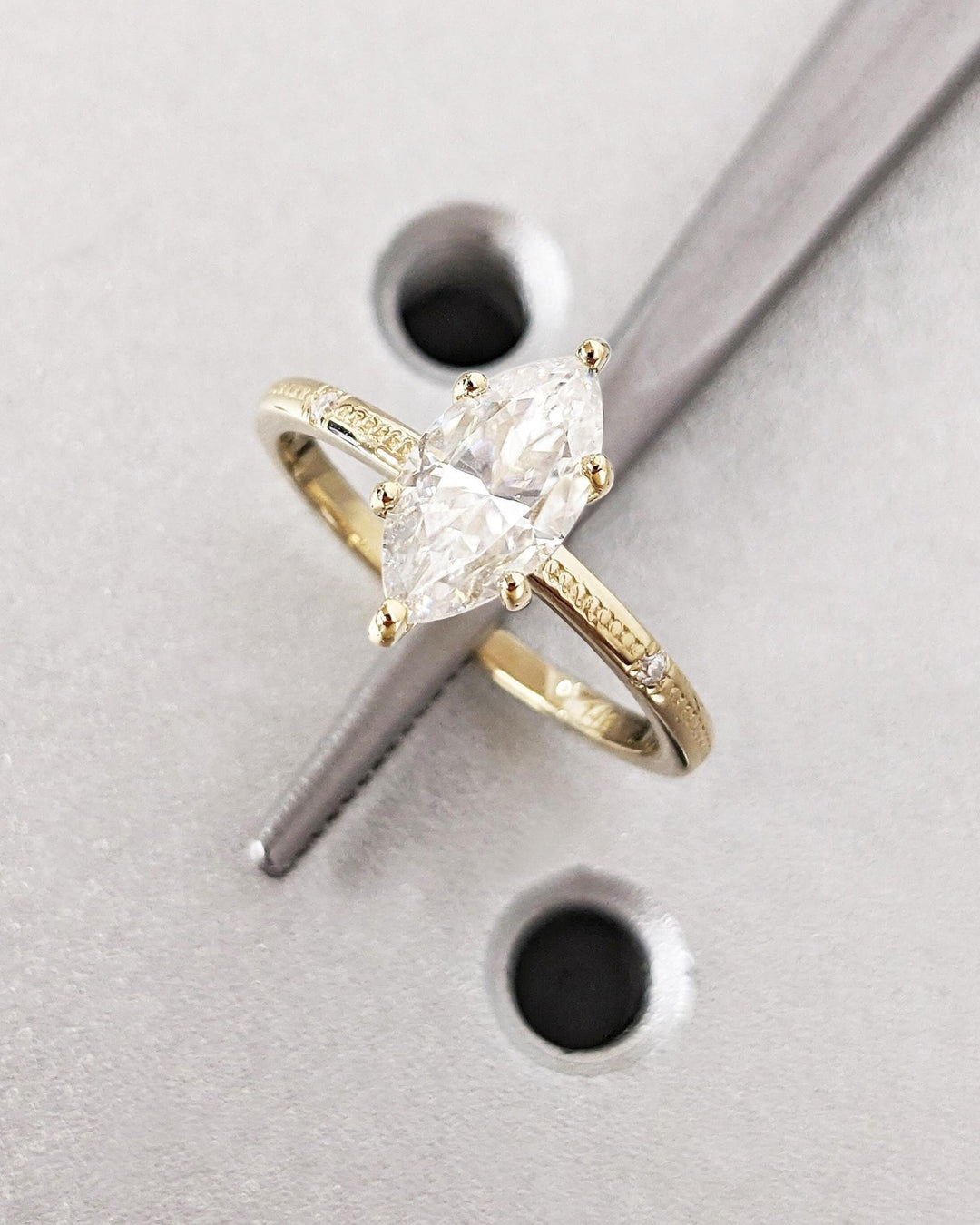 IGI certified marquise cut diamond in solitaire engagement ring setting