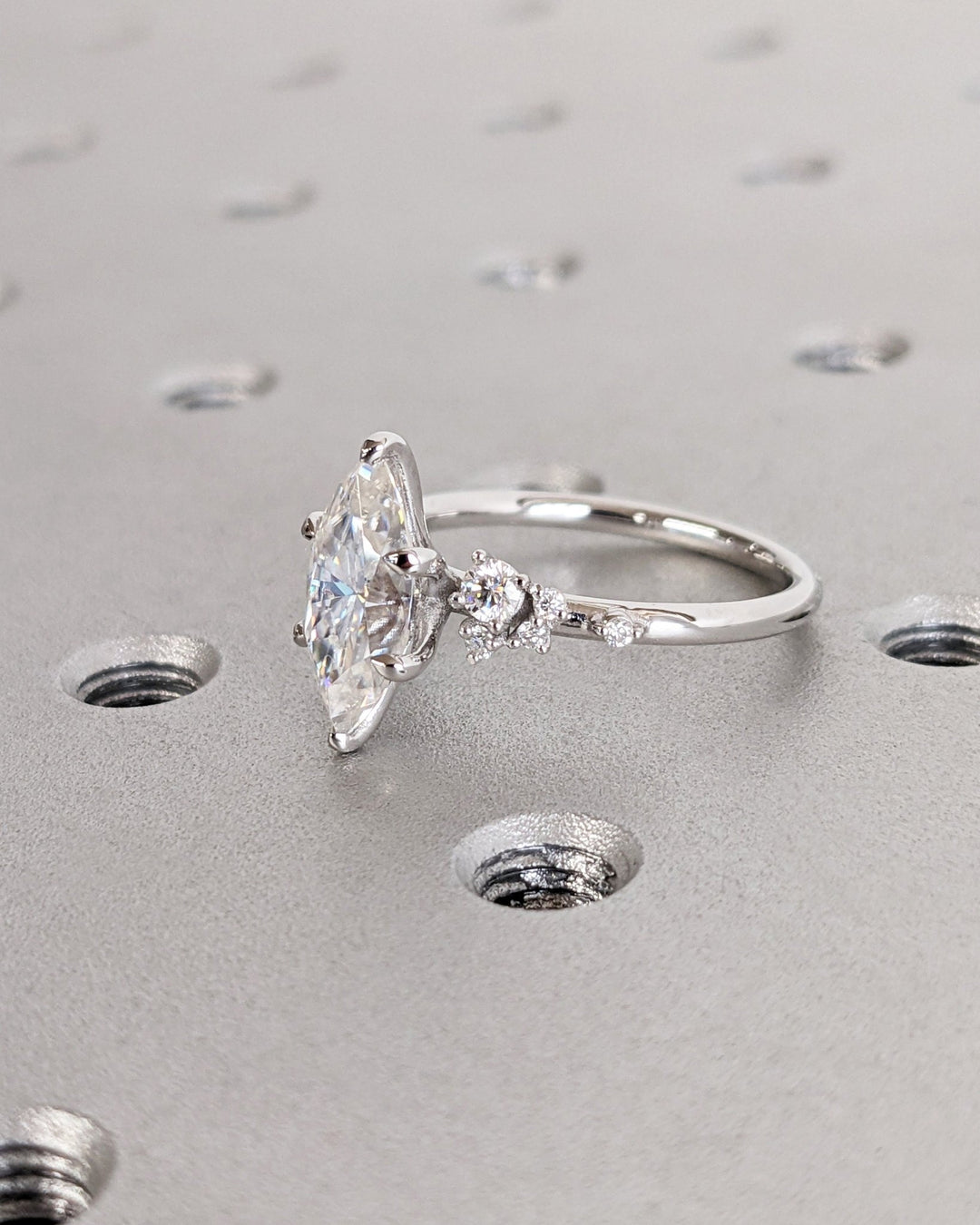 Lifestyle shot of marquise cluster diamond ring on hand