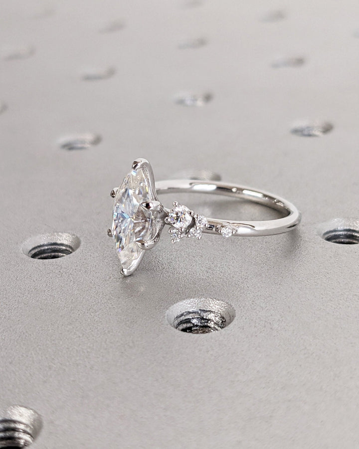 Lifestyle shot of marquise cluster diamond ring on hand