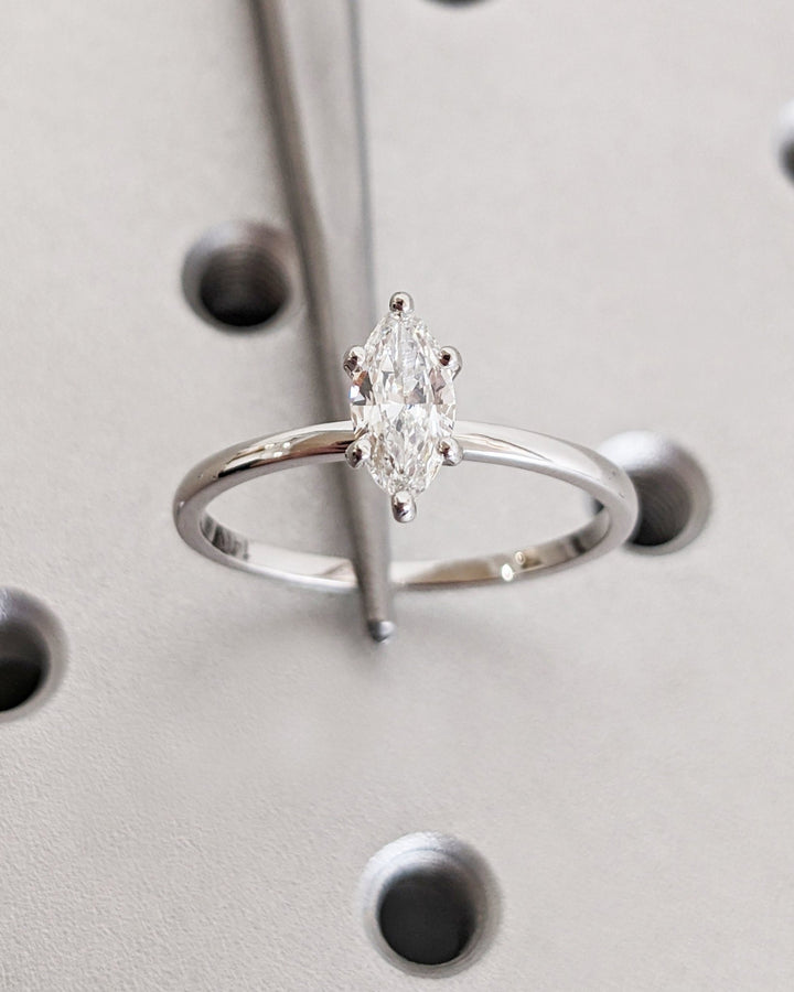 Marquise solitaire lab grown diamond ring side profile in gold setting