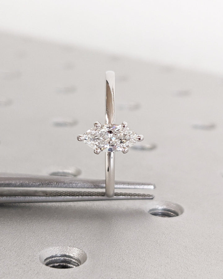 Side angle of marquise solitaire diamond engagement ring