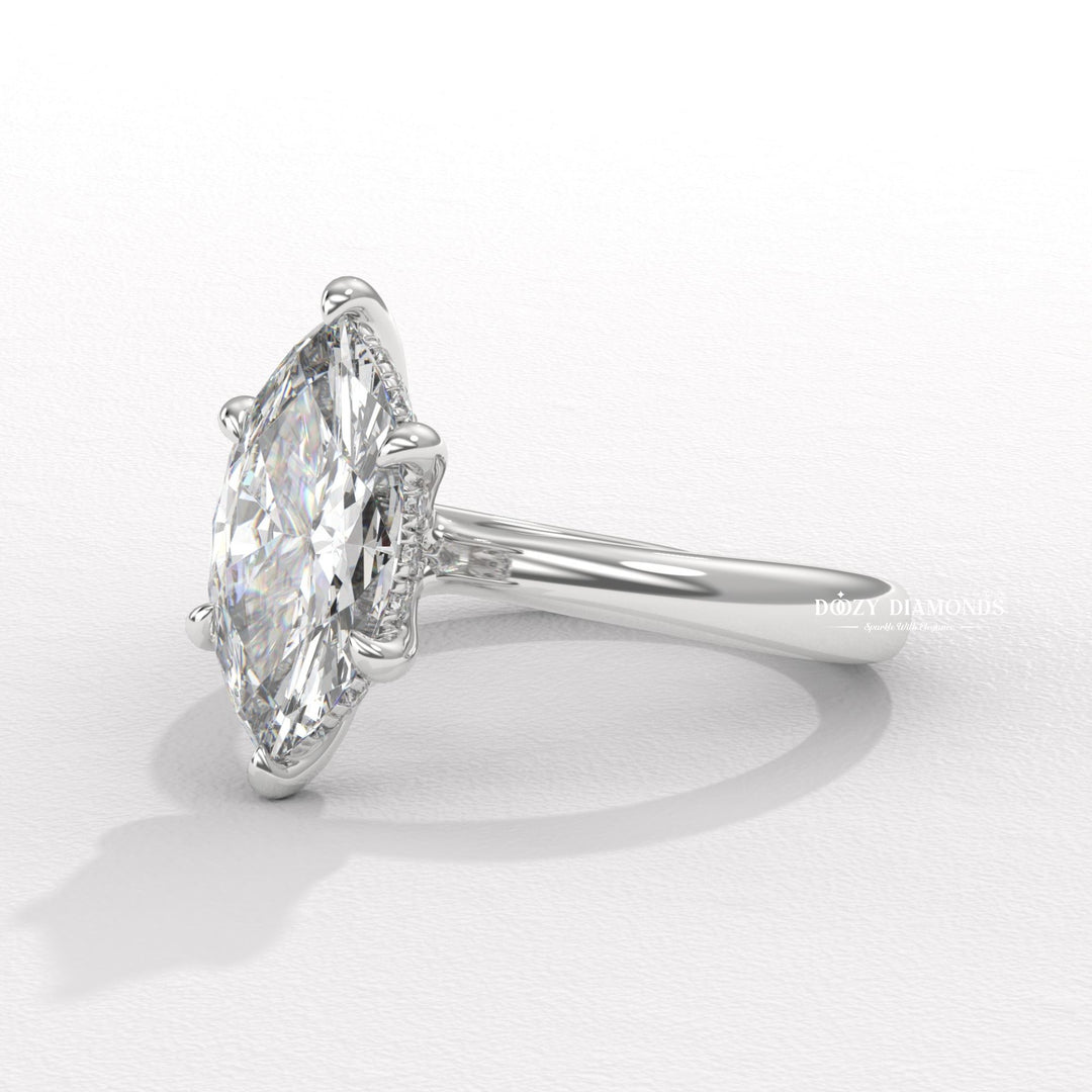 Macro shot of marquise cut diamond facets in hidden halo ring setting