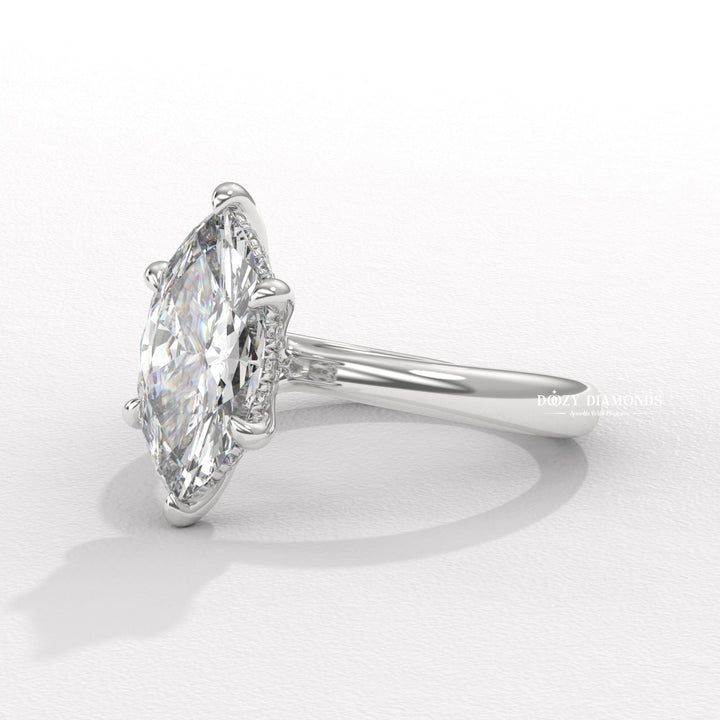 Macro shot of marquise cut diamond facets in hidden halo ring setting