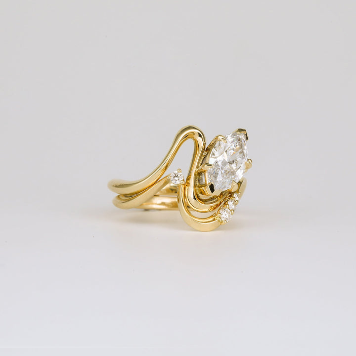 Marquise solitaire engagement ring finished in polished solid gold