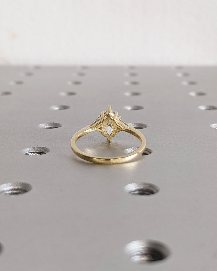 Profile view of marquise cut solitaire engagement ring band