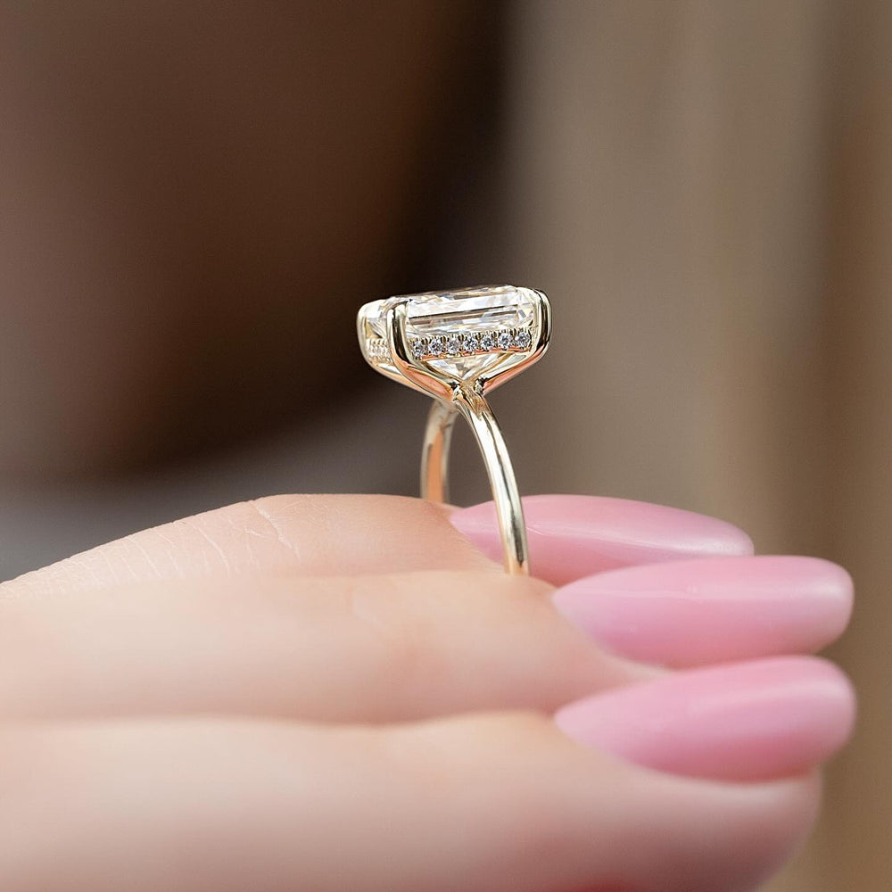 Lifestyle shot of radiant hidden halo diamond ring on hand