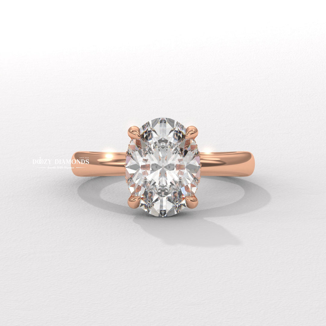 Oval solitaire engagement ring viewed from the side