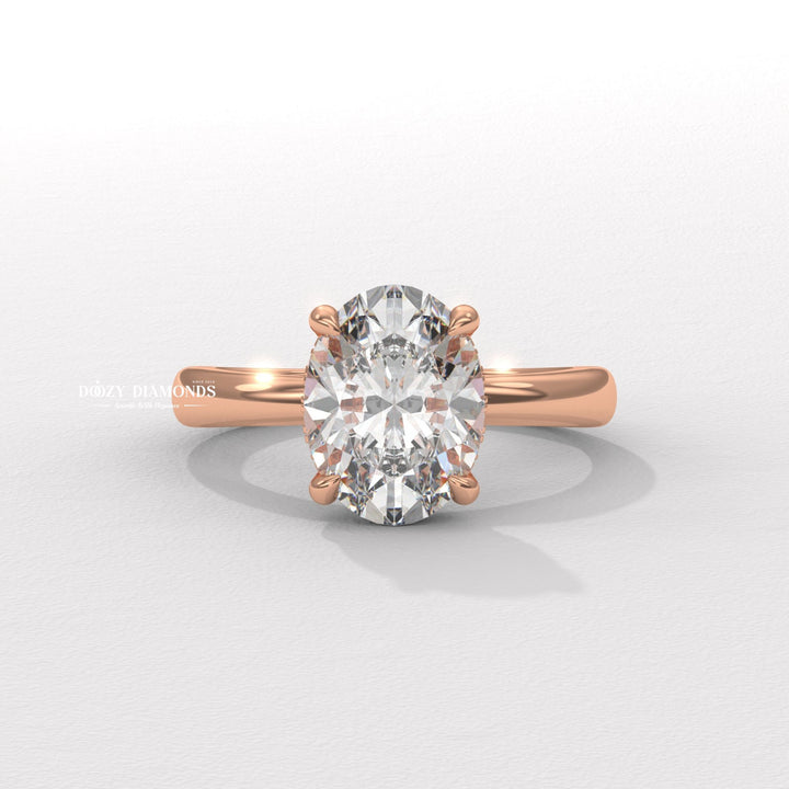 Oval solitaire engagement ring viewed from the side