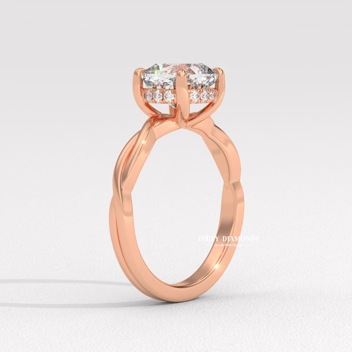 Side angle of cushion solitaire diamond engagement ring