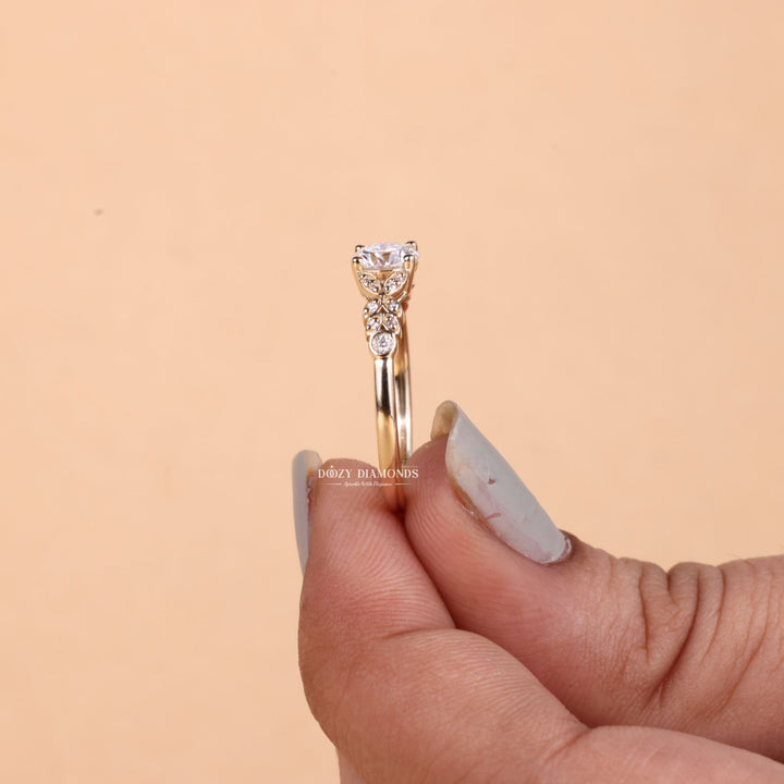 Round cut diamond ring worn on hand