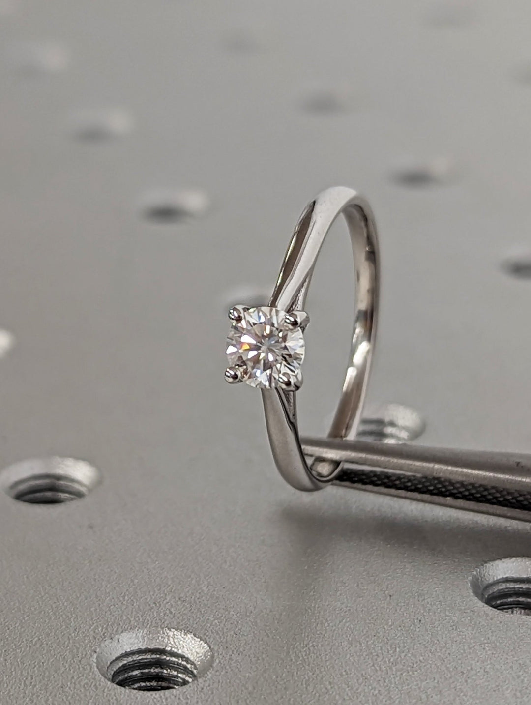 Round cut diamond ring worn on hand