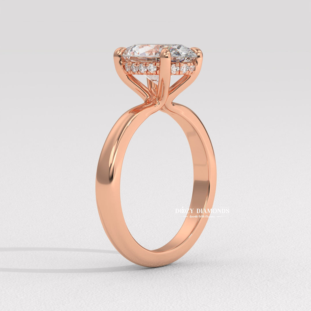 Oval solitaire engagement ring shown on hand for true-to-life sizing