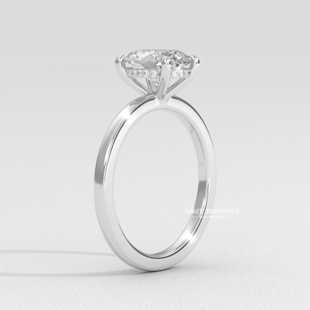 Side angle of oval solitaire diamond engagement ring