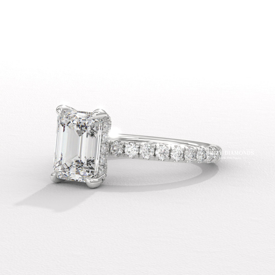 Unboxing view of emerald cut hidden halo diamond engagement ring