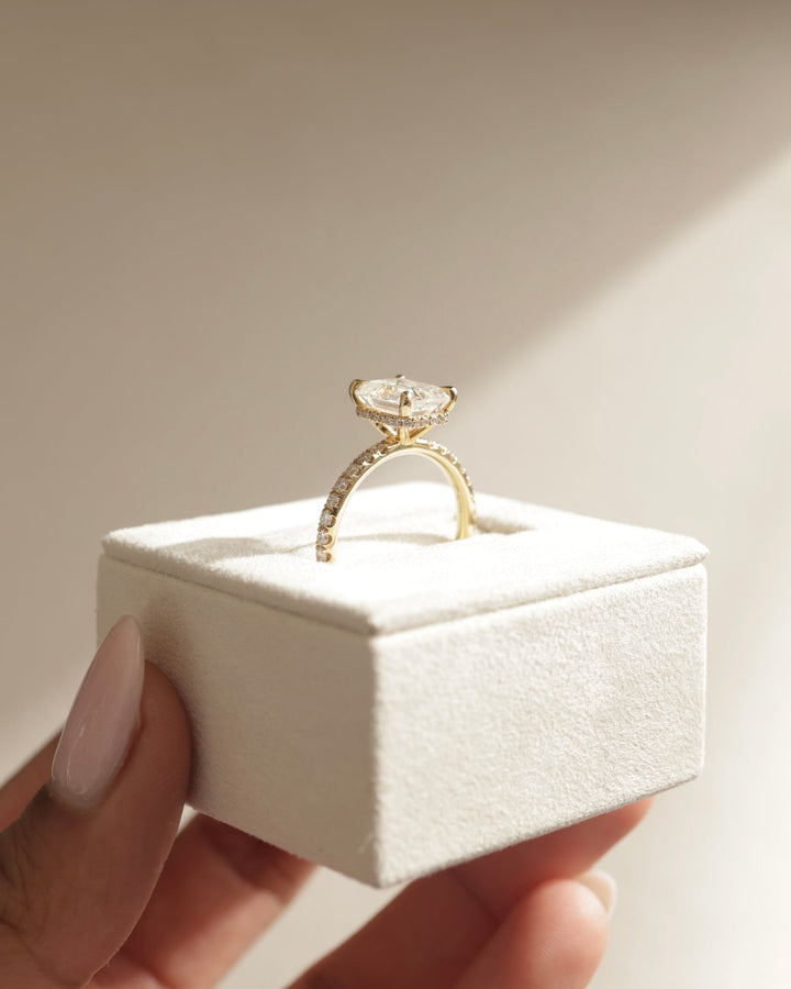 Emerald cut engagement ring side view showing band detail