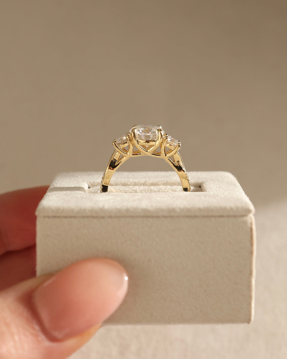 claw prong three stone setting, shared prong three stone setting, basket three stone setting, elevated three stone setting, low profile three stone setting, high profile three stone setting