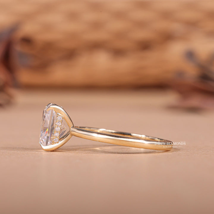 Profile view of cushion cut hidden halo engagement ring band