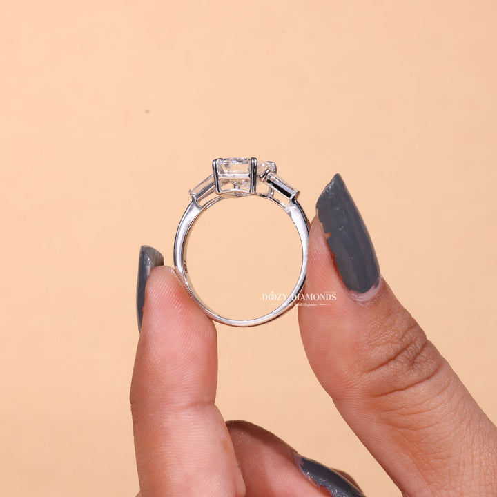 Emerald three stone engagement ring finished in polished solid gold