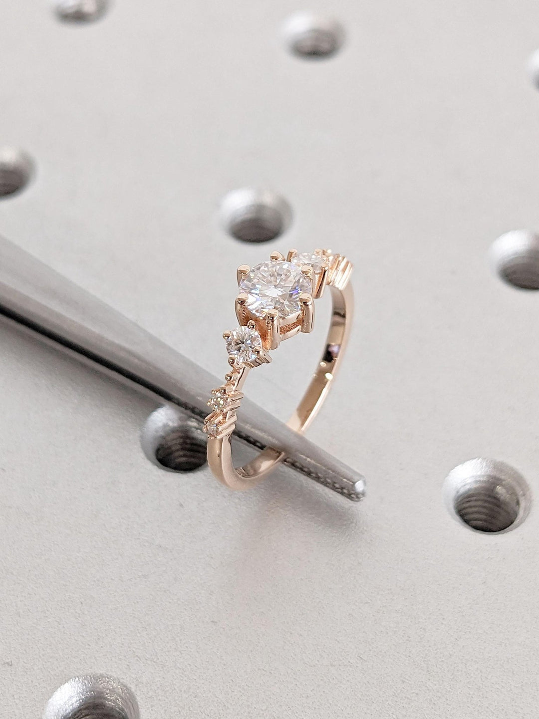 Round cluster engagement ring finished in polished solid gold