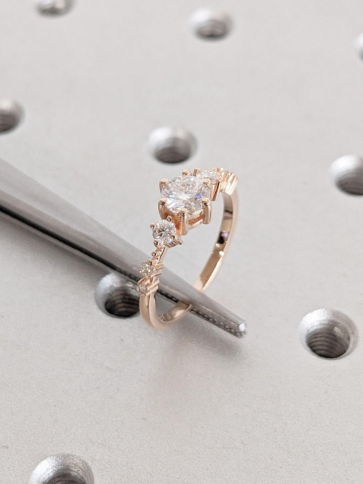 Round cluster engagement ring finished in polished solid gold