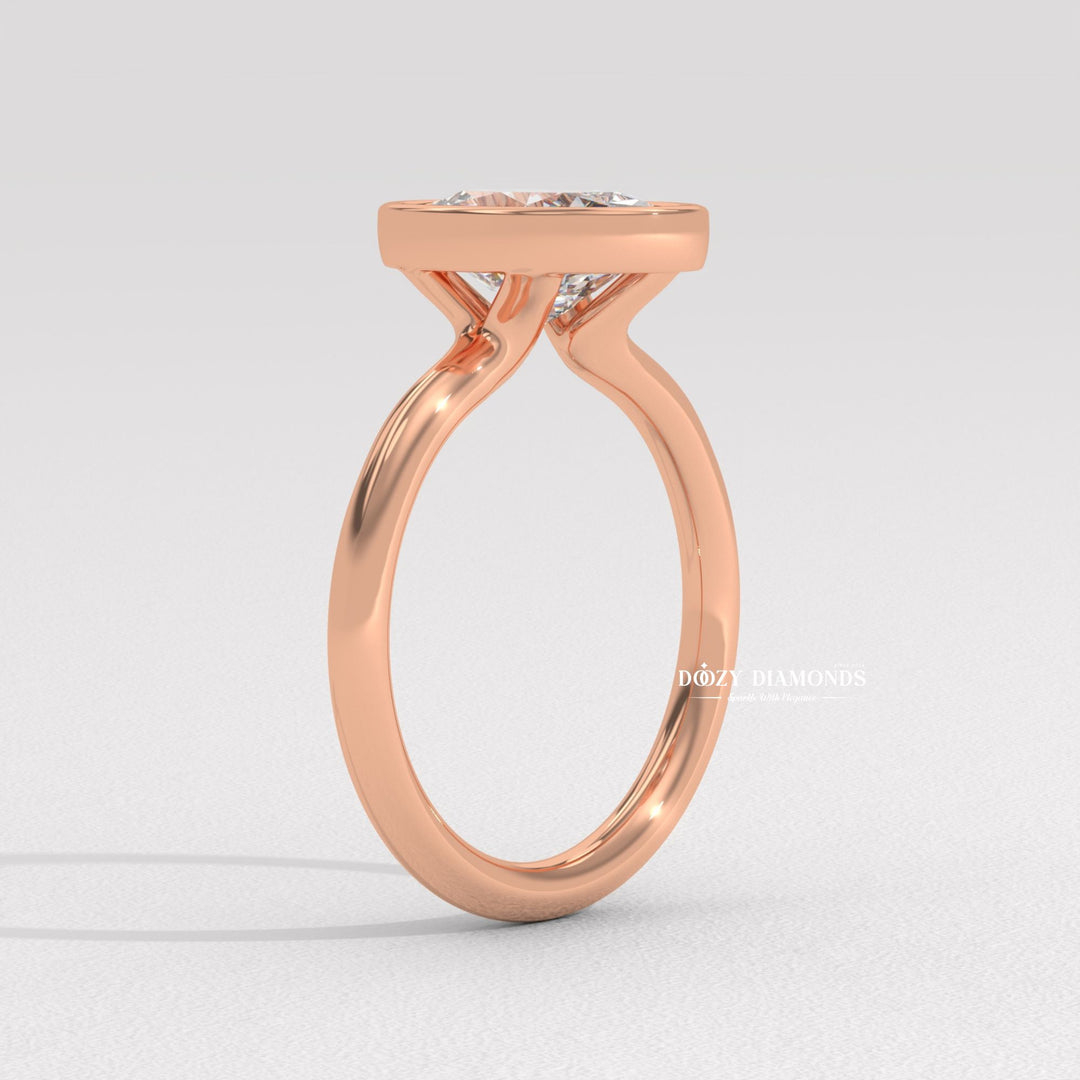 Top-down view of oval cut bezel engagement ring