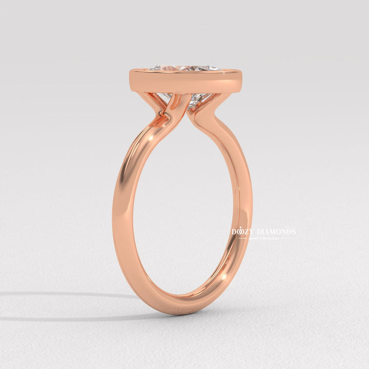Top-down view of oval cut bezel engagement ring