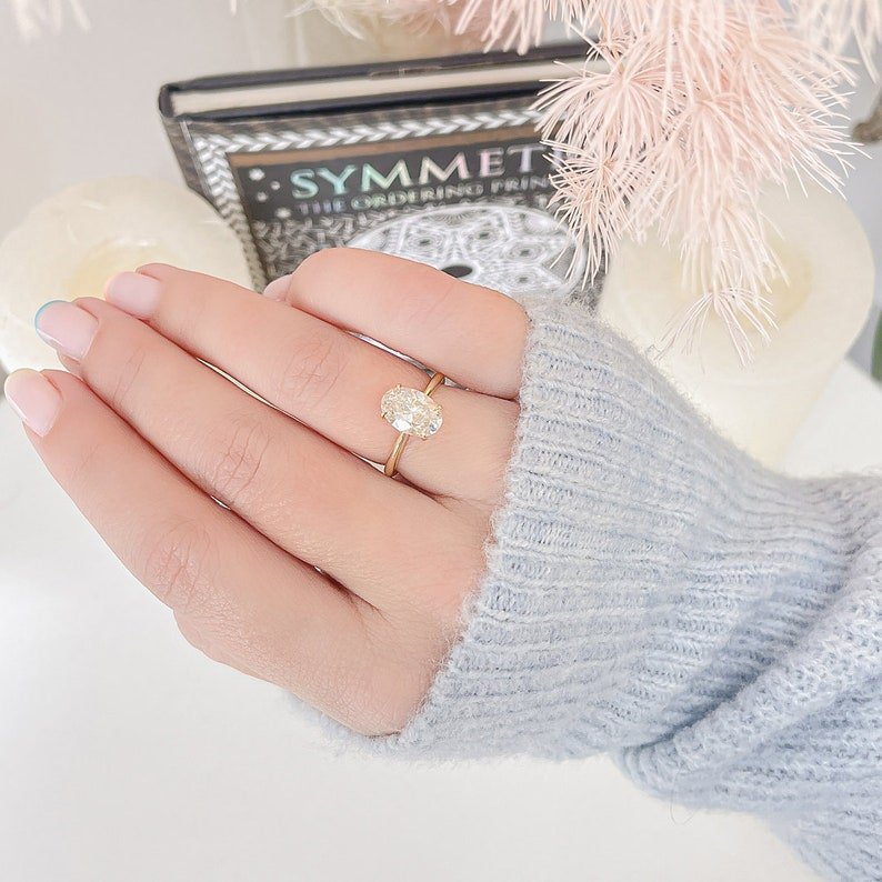 Oval solitaire engagement ring with certified lab grown diamond
