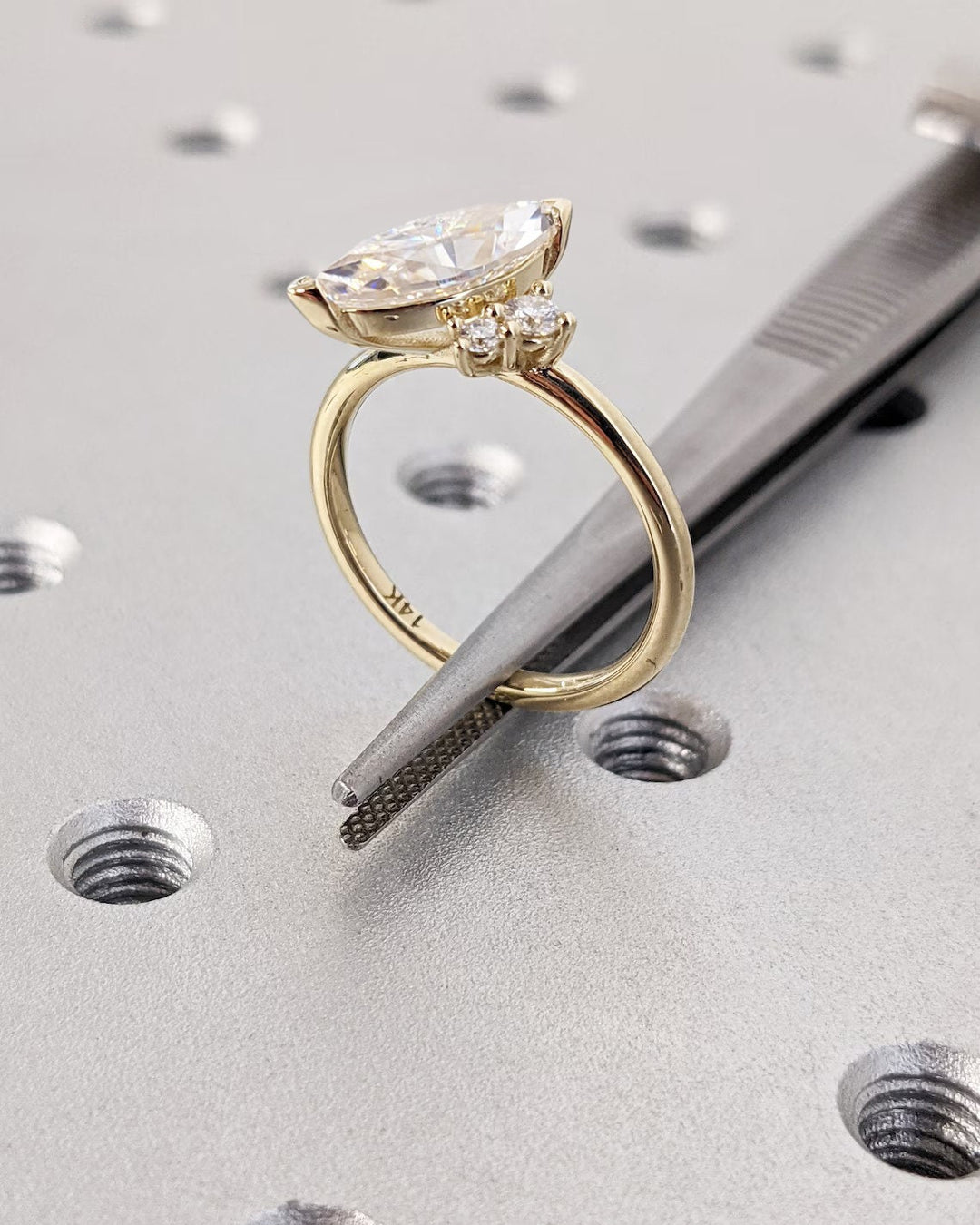 Marquise cut cluster engagement ring with IGI certified center diamond