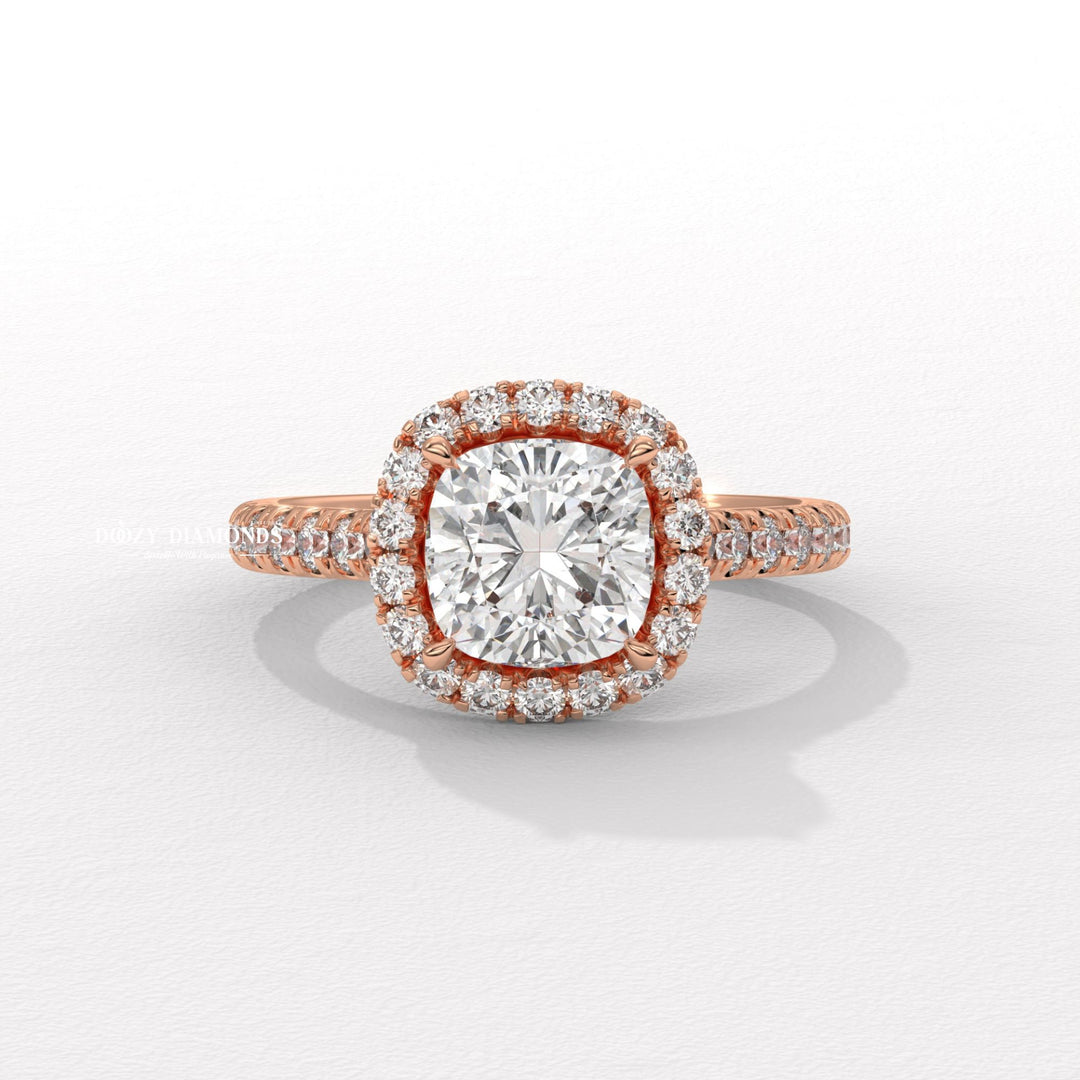 Close-up of cushion cut center diamond in pave engagement ring